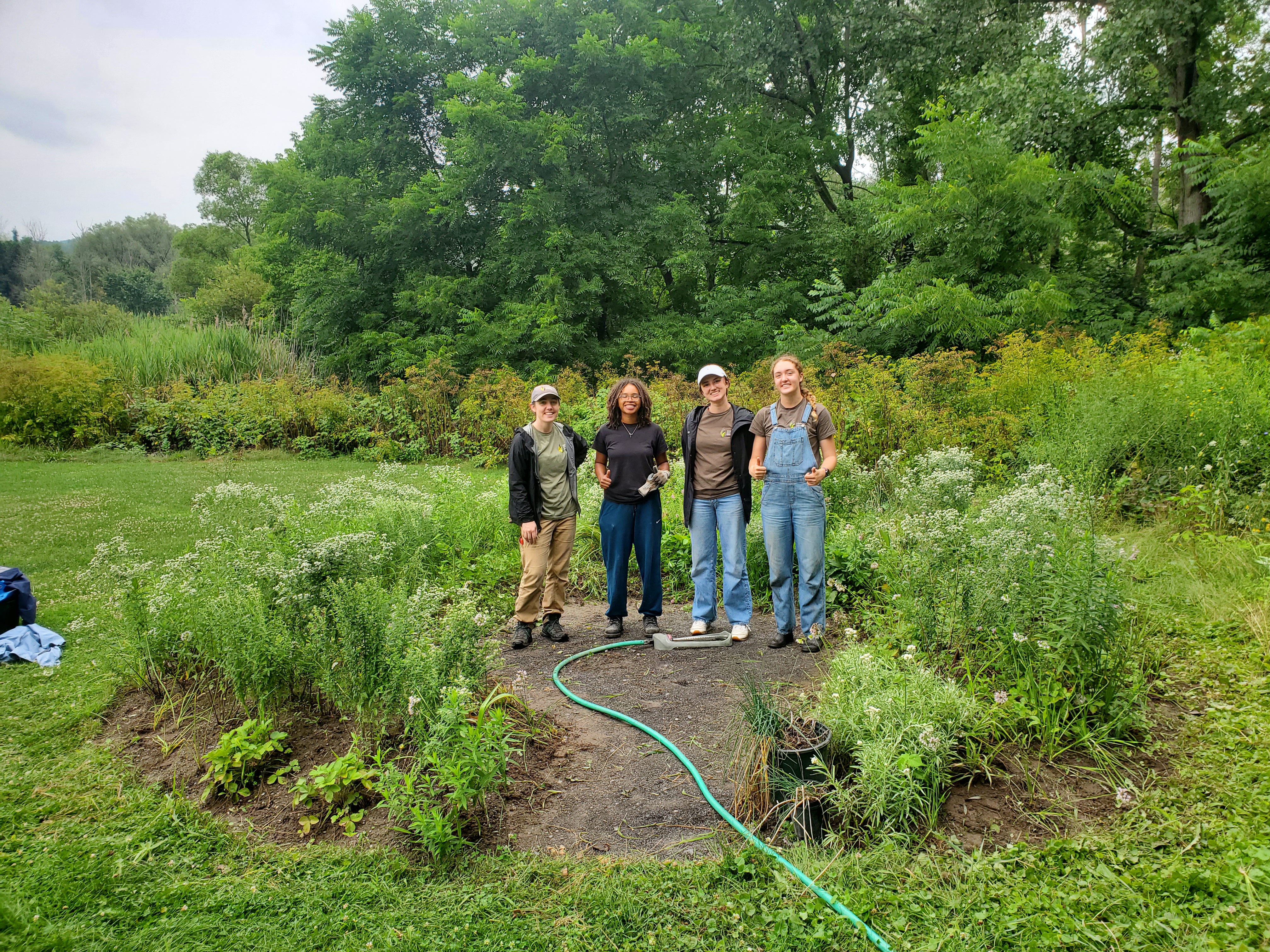Women standing in a round garden