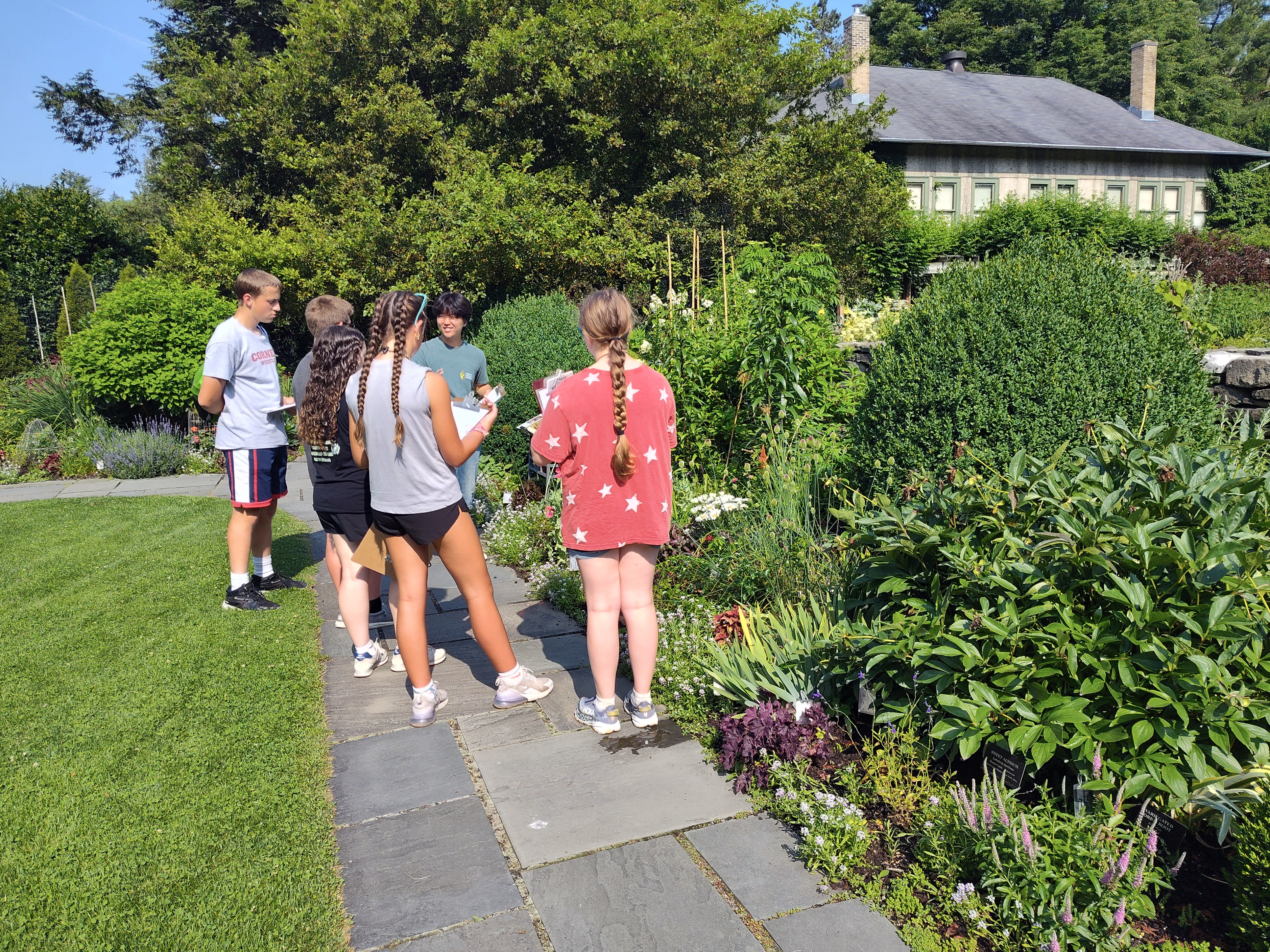 Joshua in Young Flower Garden with students
