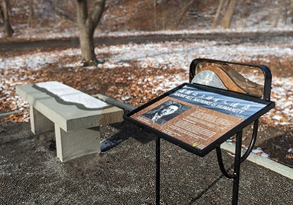 Stone bench and educational sign