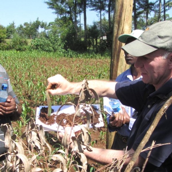 Johannes Lehmann speaks with extension officials in western Kenya about soil organic matter
