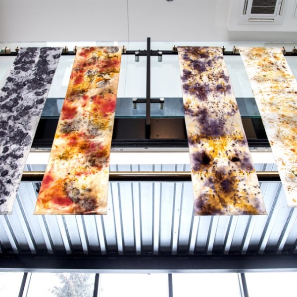 Banners with designs created from natural dye