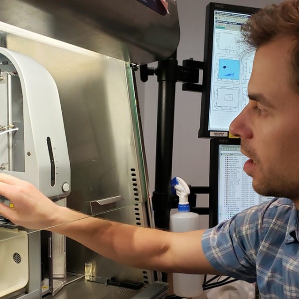 Adam Wojno setting up samples in a cell sorter