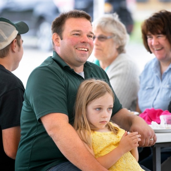 Nate Chittenden with his daughter at table