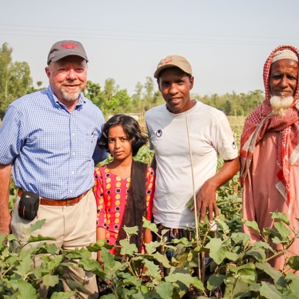 professor with farmers in Bangladesh