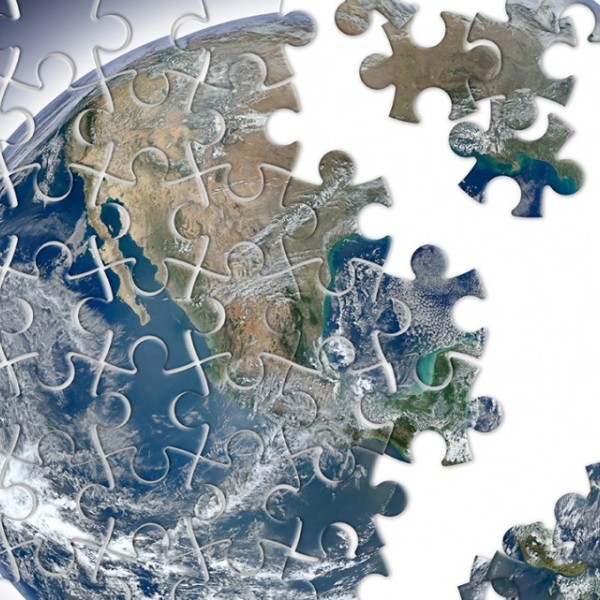 Puzzle pieces creating an image of the earth