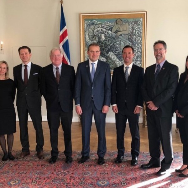 Researchers and professionals stand for a photo