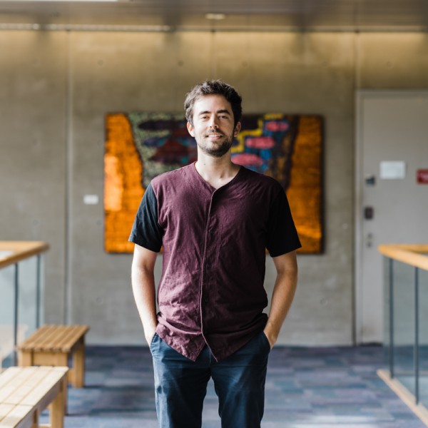 Andrew Moeller standing in a hallway at Corson Hall