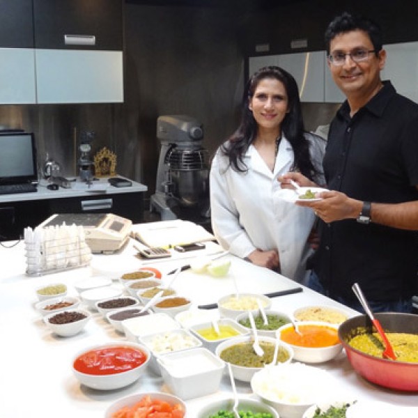 Deepak Amin and woman in kitchen