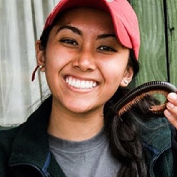 Nicole Tu-Maung holding a giant African millipede