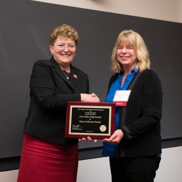 Dean Boor shakes hands with French