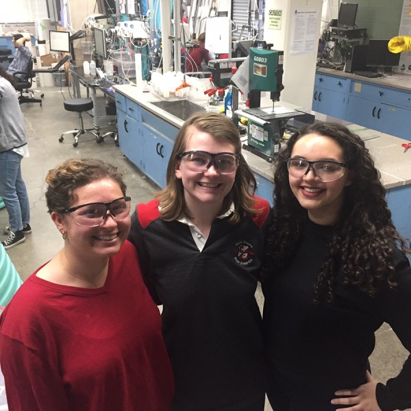 Students Zoe Maisel, Natalie Mottl, and Erica Marroquin pose in lab.
