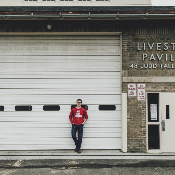 Conor McCabe stands outside Livestock Pavilion building