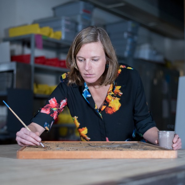 Kirsten Kurtz touches up a painting