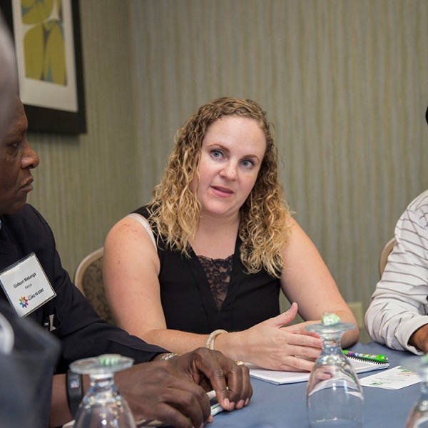 Farmers hold a discussion around a table