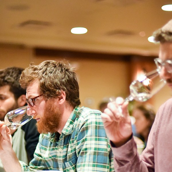 vineyard owners smelling wine