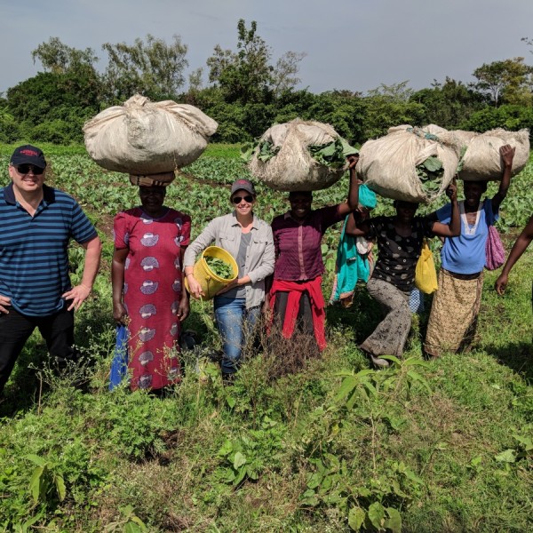 Researchers and farmers pose for a picture