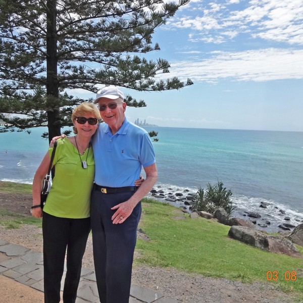 Russ Skelton Jr. and Bonnie Renzi stand in front of the shore