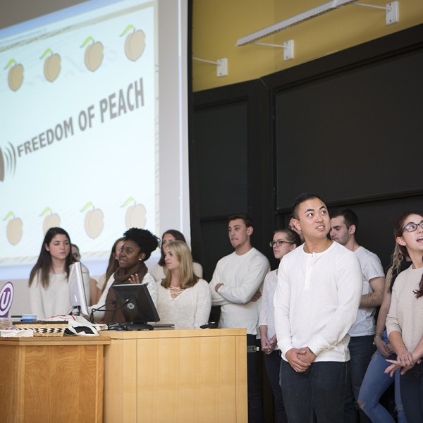 Members of the winning team give a presentation