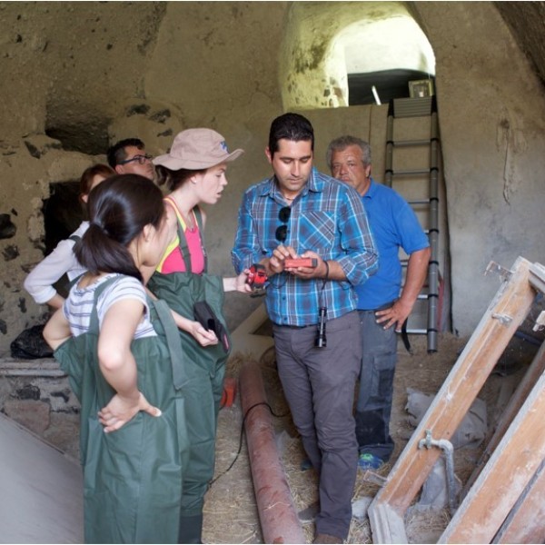 Researchers stand in a cavern