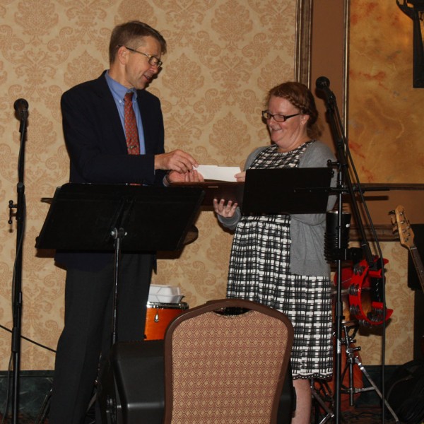 Sarah Lincoln receives an award from Jan Nyrop