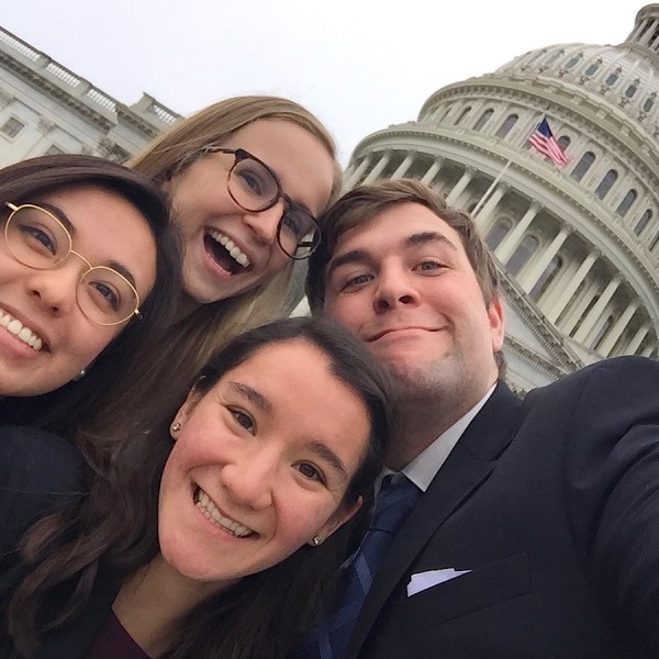  Becky Cardinali, Tiana Le, Kerry Mullins, and Jeff Fralick posing in front of the U.S. Capitol.