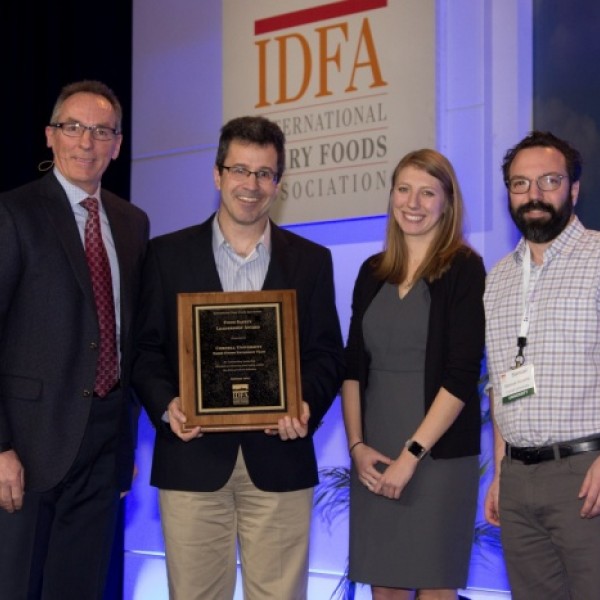 People standing with award