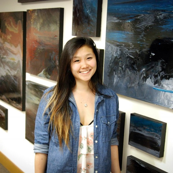 Viola Yu stands in front of images