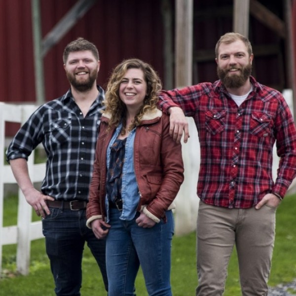 Lively Run Goat Dairy team stands in front of barn