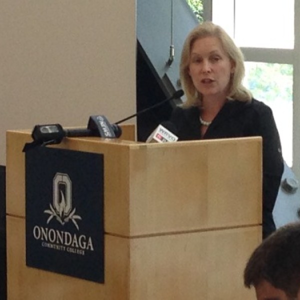 A woman speaks at a podium