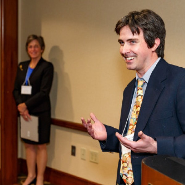 A man speaks at an award dinner