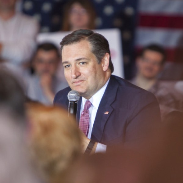 A man, Ted Cruz, speaks into a microphone
