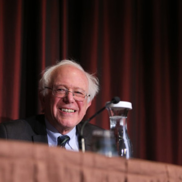 A man, Bernie Sanders, stands at a podium