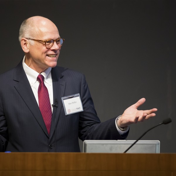 Max J. Pfeffer stands at a podium
