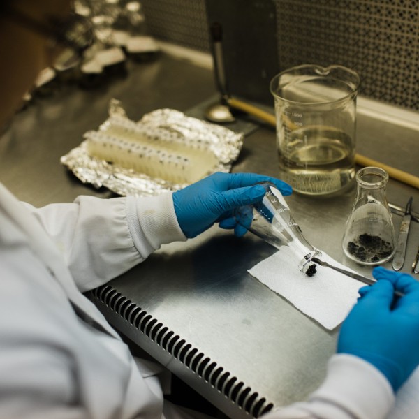 A man sitting at a lab bench doing research