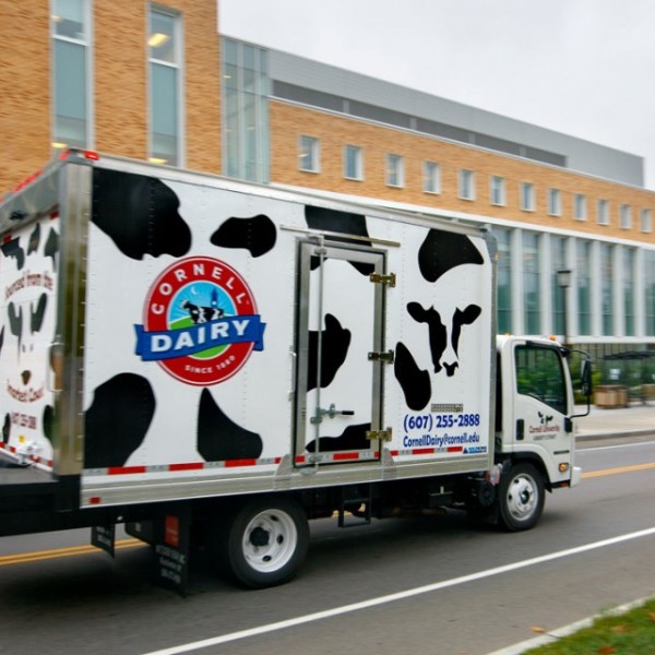 A truck driving down a road