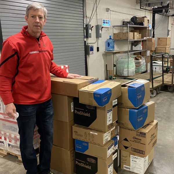 a mand standing with boxes