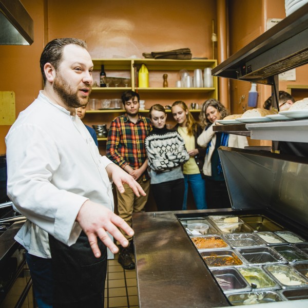 A local restaurant chef gives current students a tour behind the scenes of his kitchen.