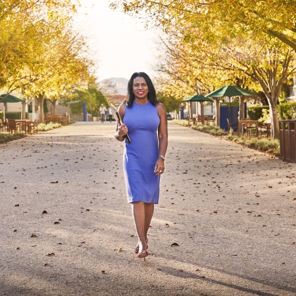 CALS Alumna Deborah Arrindell '79 walks outside the Amgen Inc. campus in Thousand Oaks, California.