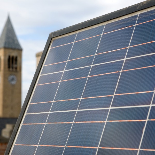 A solar panel in front of McGraw Tower