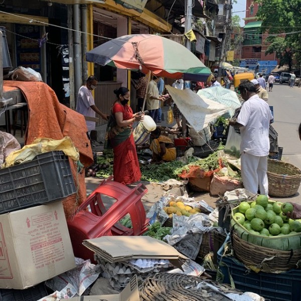 A woman shops for produce at the Shyambazar Market in Kolkata, India, during the nationwide COVID-19 lockdown in the spring.