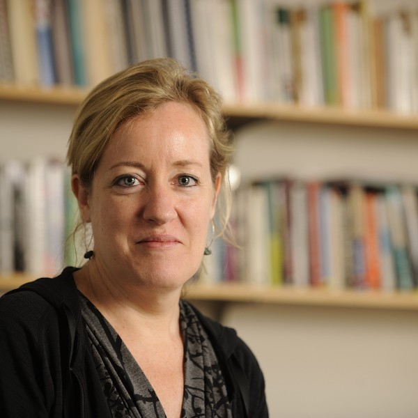 Professor portrait in front of bookcase 