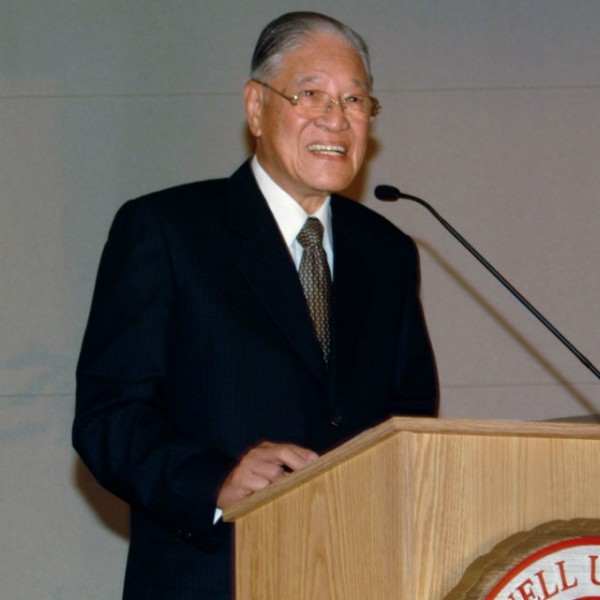 A man standing at a podium and talking