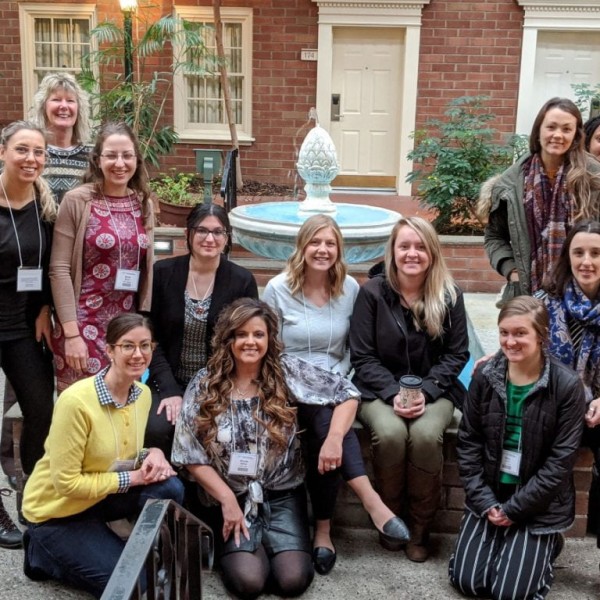 Group of nutrition educators posting in front of water fountain in Albany, NY
