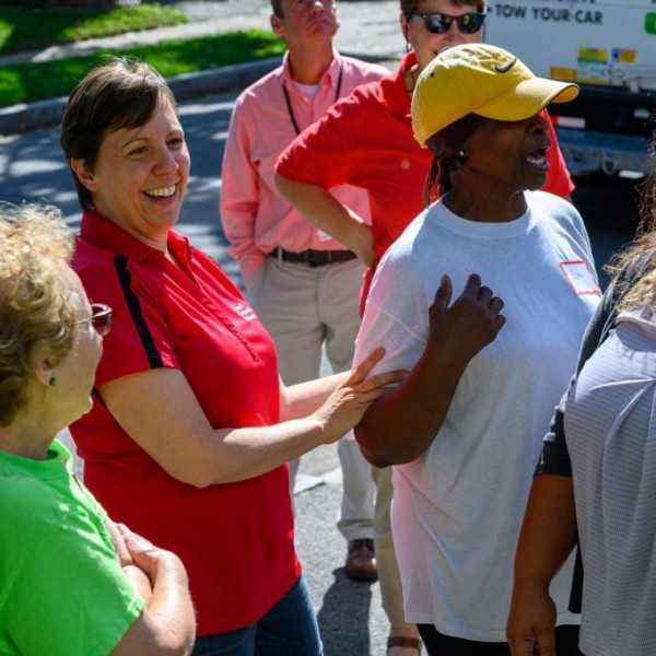 Group of people conversing in the street