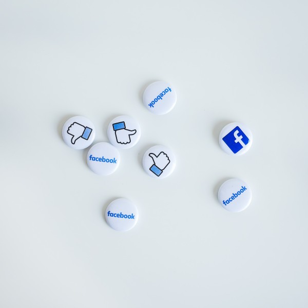 White pins that have Facebook logos on them
