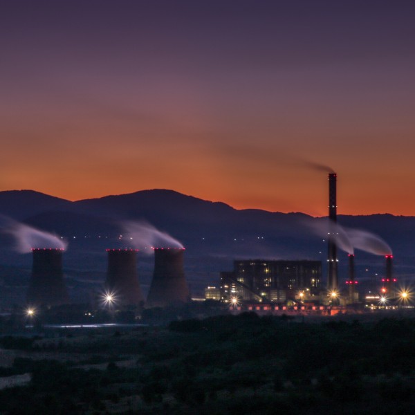 a geothermal power plant at sunset