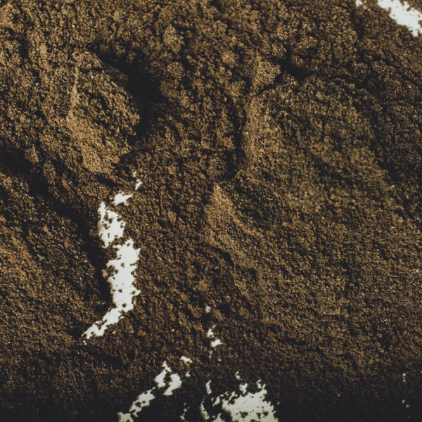 brown soil laid out on a white counter