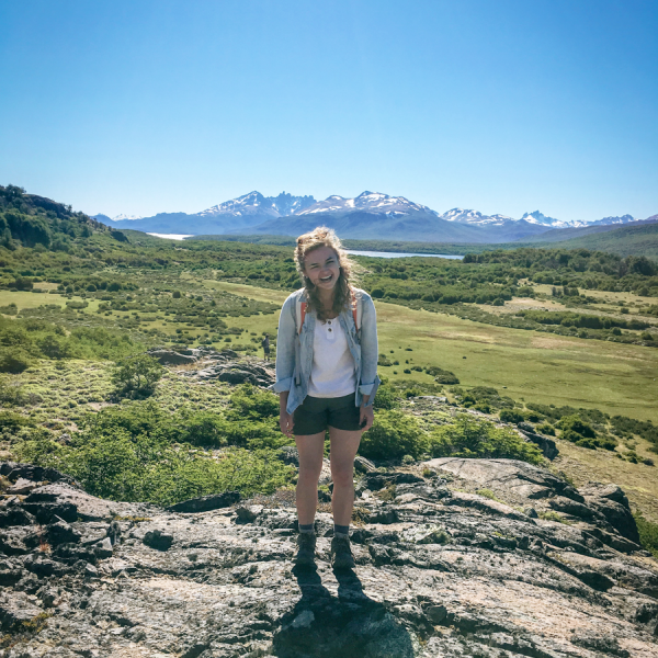 Hannah Fuller stands in front of the Patagonia mountains