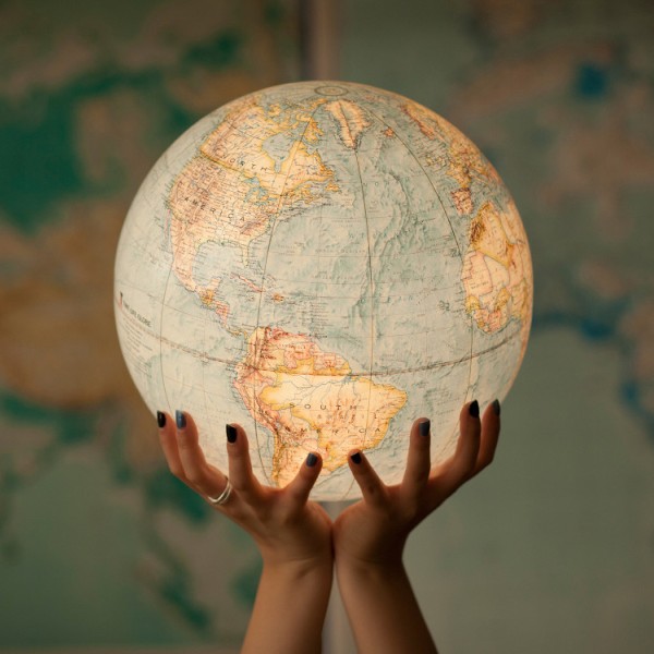 Hands holding a globe