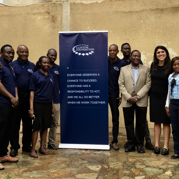 Group stands together with Clinton Development Initiative banner
